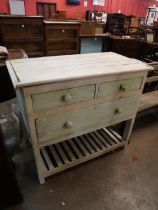 A painted pine four drawer work table
