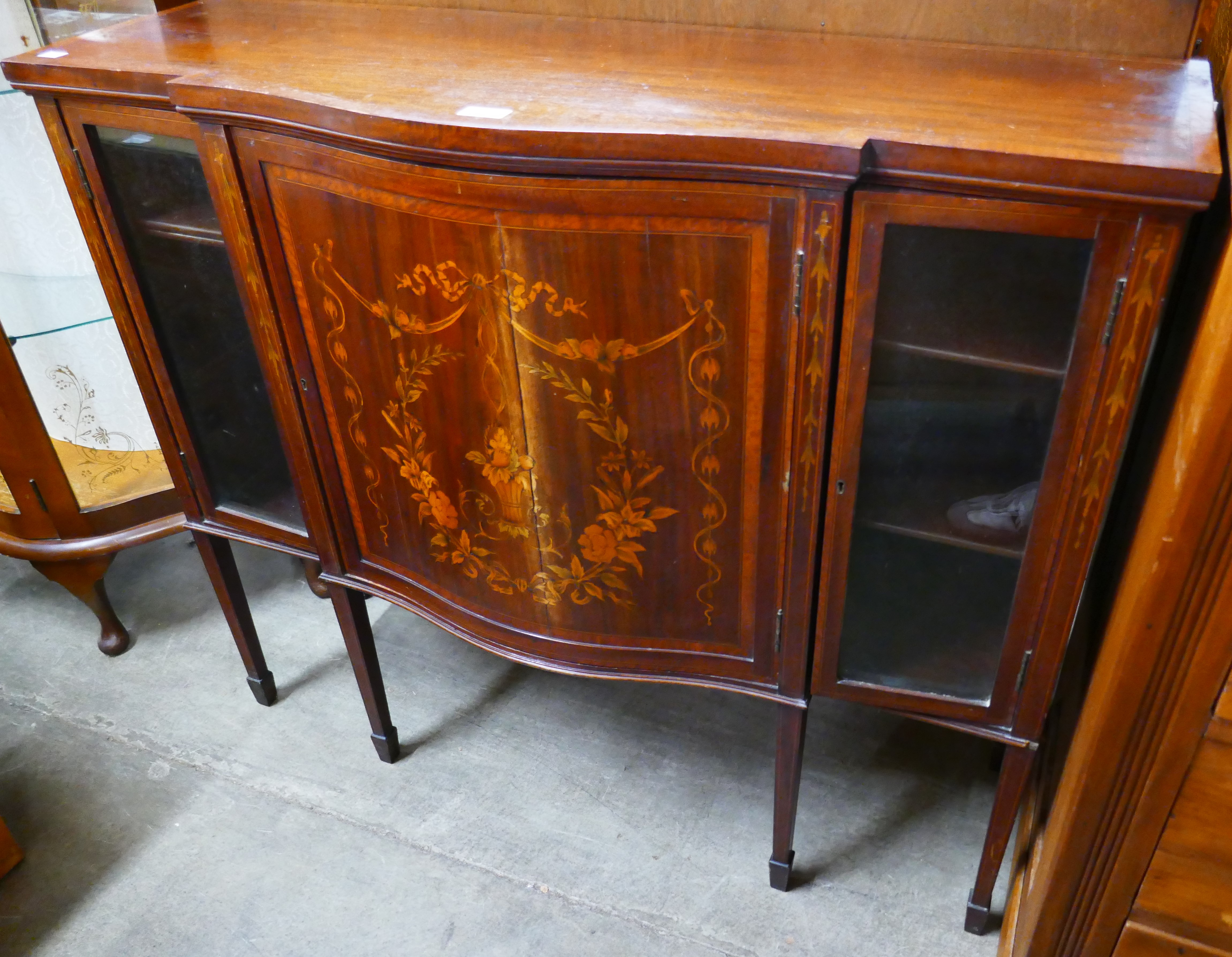 An Edwardian marquetry mahogany cabinet