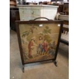 A mahogany tapestry firescreen