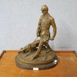A bronze figure of huntsman and hound, on black marble socle