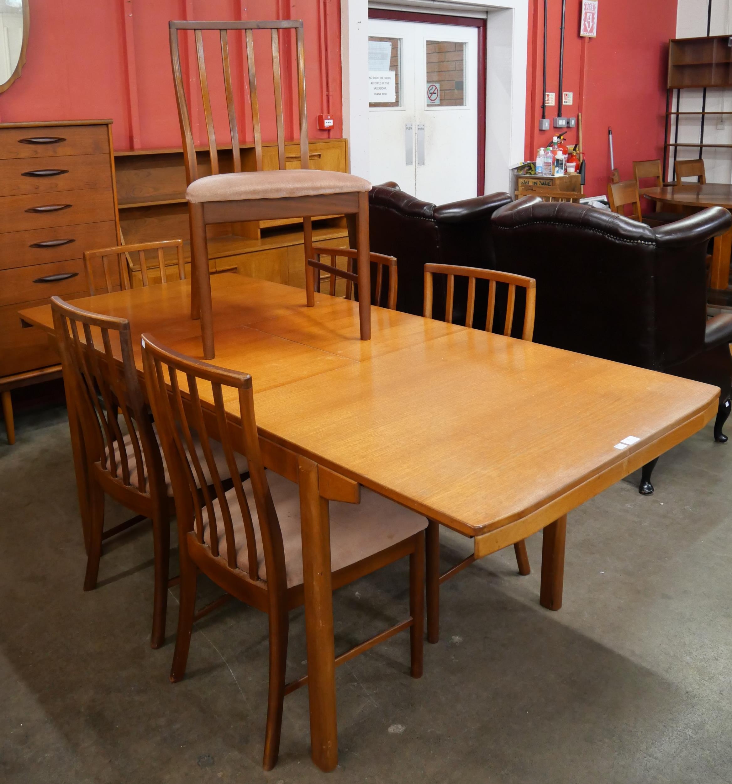 A McIntosh teak extending T2 model dining table and six chairs