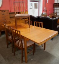 A McIntosh teak extending T2 model dining table and six chairs