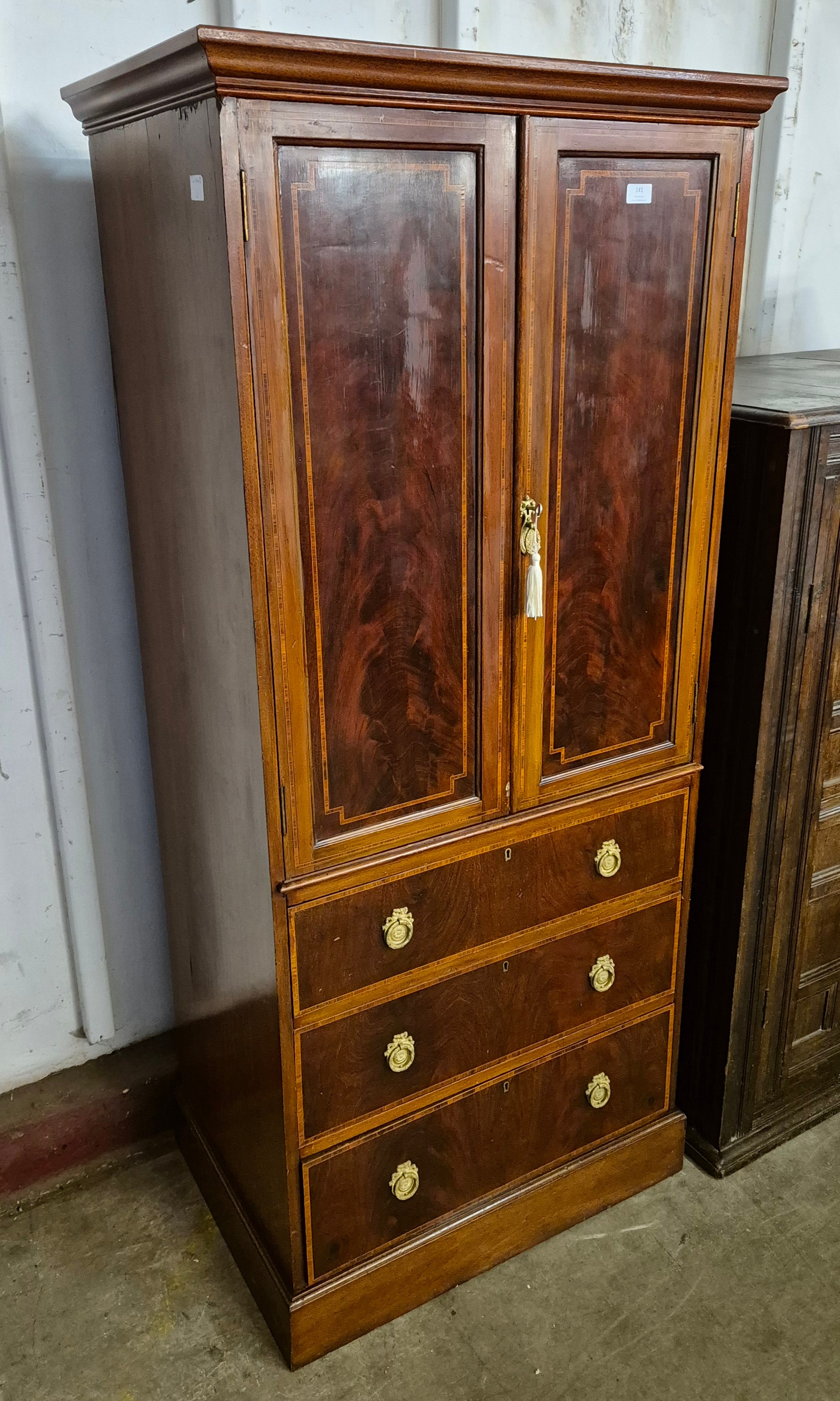 An Edward VII inlaid mahogany bachelors wardrobe