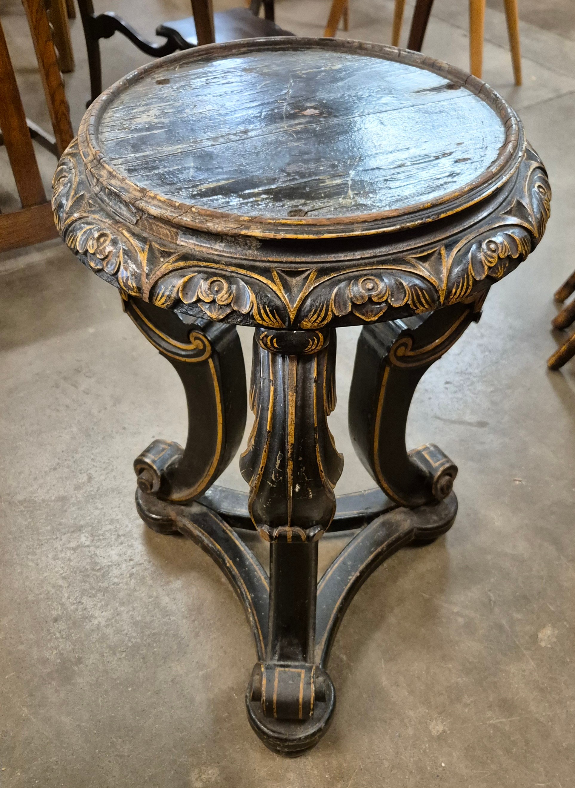 A 19th Century style Italian ebonised and parcel gilt jardiniere stand