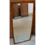 A teak framed mirror