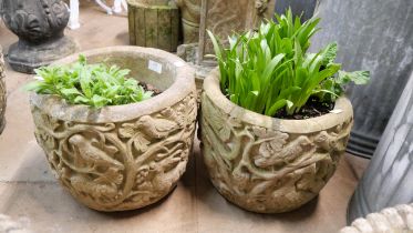 A pair of Tree of Life design concrete planters