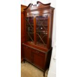 An Edward VII inlaid mahogany bookcase