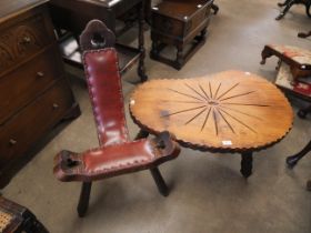 A Spanish Brutalist Birthing chair and a Spanish Brutalist coffee table on a trip base