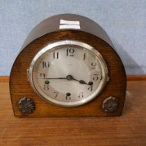 An oak cased Enfield mantel clock with chiming movement