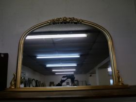 A large gilt framed overmantel mirror