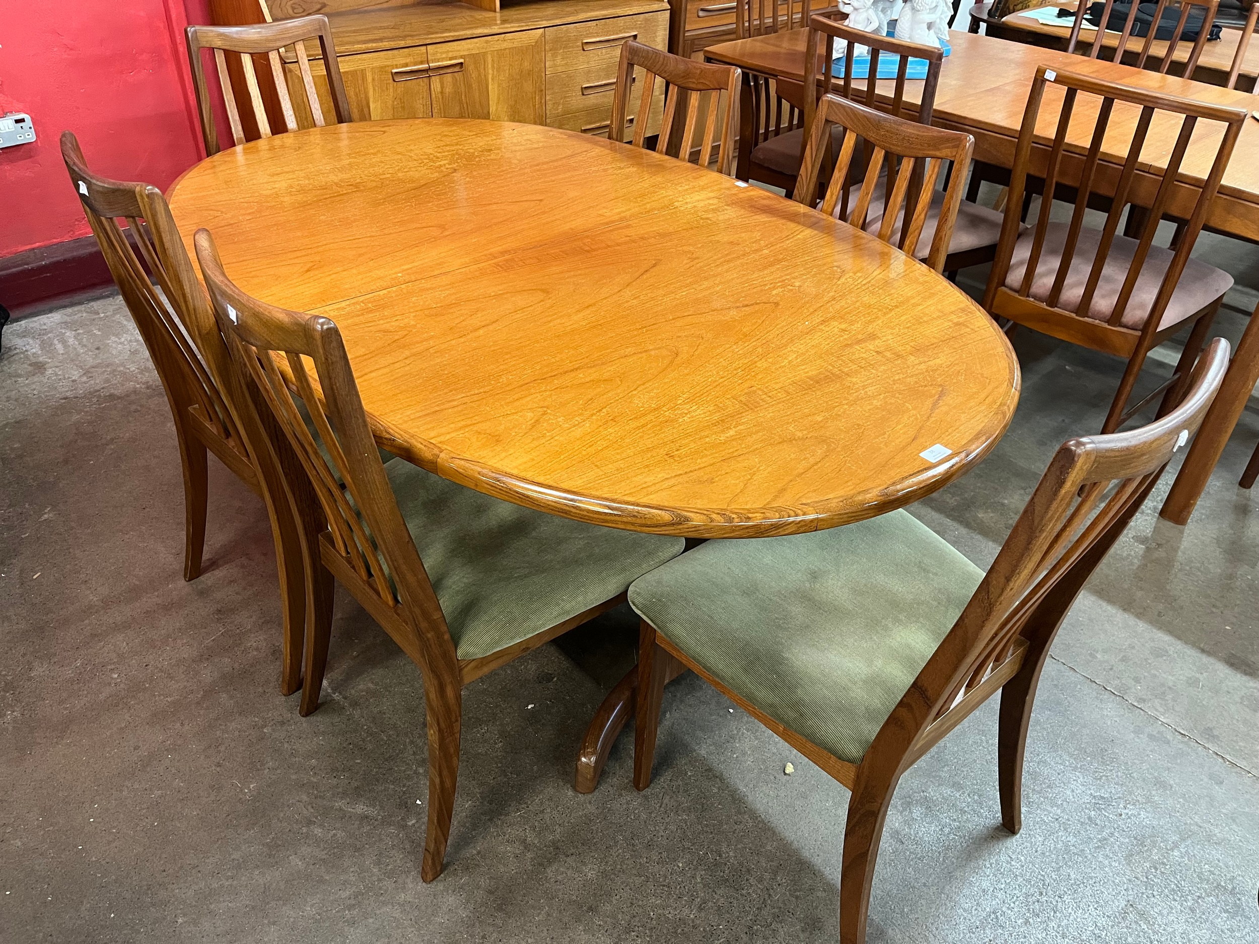 A G-Plan Fresco teak extending dining table and six chairs