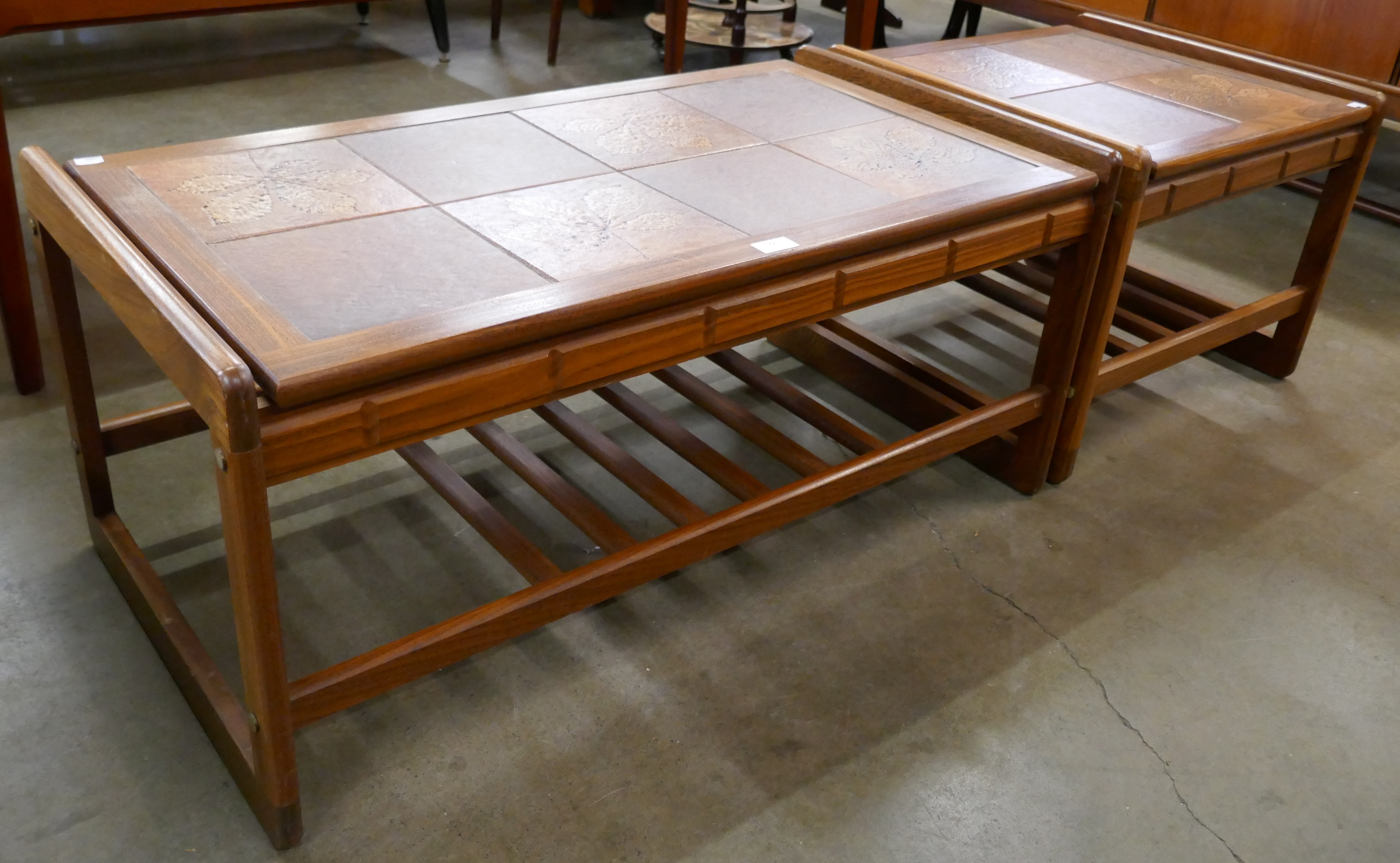 Two teak and tiled topped coffee tables