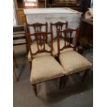 A set of four carved mahogany dining chairs