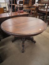 A 19th Century French carved oak circular centre table