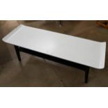 A Formica sleigh topped coffee table