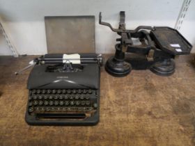 A Corona typewriter and a set of weighing scales