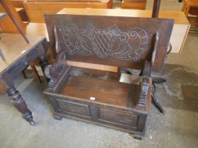 A carved oak monk's bench