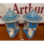 A pair of large Sevres style powder blue porcelain vases and covers