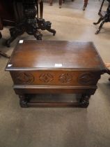 A carved oak shoe box