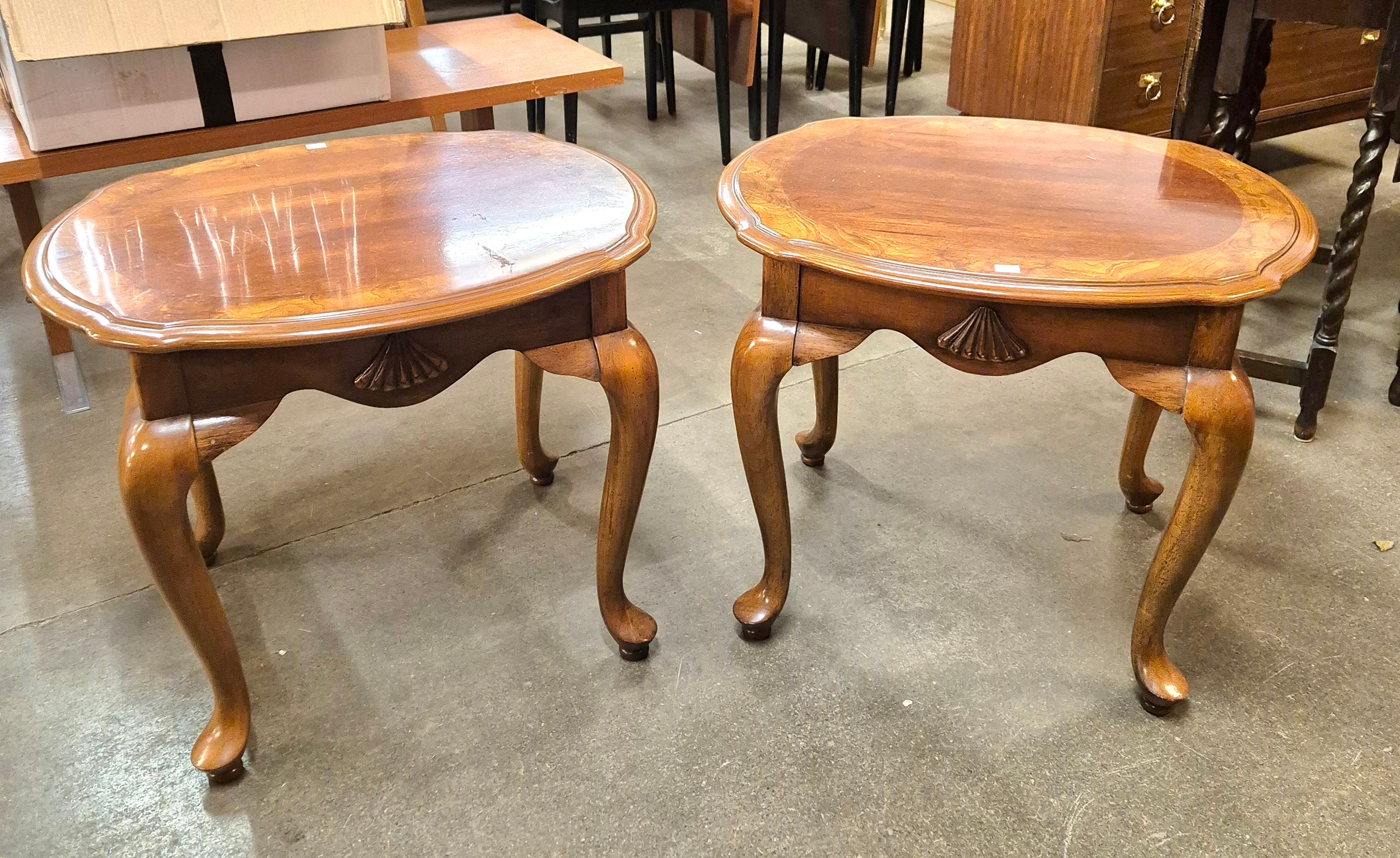 A pair of mahogany and walnut lamp tables