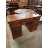 A mahogany pedestal desk