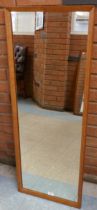 A teak framed mirror