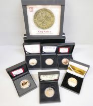 Six presentation coins in boxes, a £5 Magna Carta proof coin, a George of Cambridge commemorative