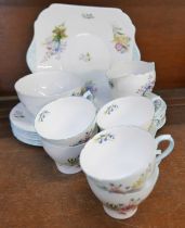 Shelley Wildflowers teawares, six cups, five saucers, six tea plates, cream, sugar and a bread and