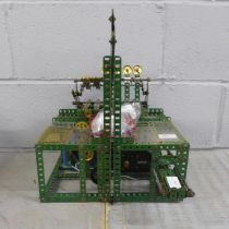 A circa 1950s red/green Meccano Aunt Sally arcade game, coin operated with electric motor, 33cm wide