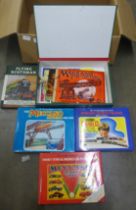 A box containing Meccano and train books and Meccano instruction booklets