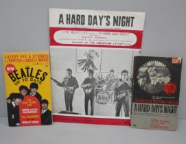 Beatles interest; A Hard Day's Night music and words sheet, two paperback books, The Beatles Up To