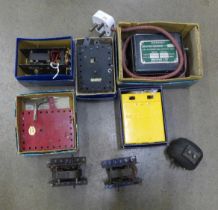 A box of Meccano electric and clockwork motors and transformers