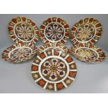 A set of six Royal Crown Derby 1128 wavy edge side plates and one other 1128 circular side plate,