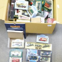 A box of Lledo model vehicles, Comedy Classics, The Spirit of Brooklands, Famous Stores of London,