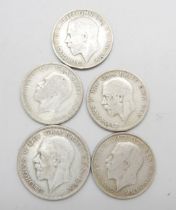 A 1930 half-crown, (rare date), and four silver florins 1921, 1922, 1928 and 1931