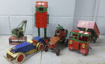 Five Meccano models; tipper truck, tow vehicles, a robot and crane