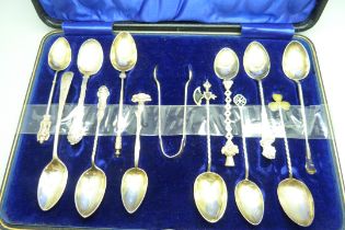 Twelve assorted hallmarked silver spoons and a pair of silver sugar bows, 126g