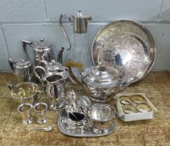 A collection of plated ware, including a cruet set and a three piece tea service **PLEASE NOTE