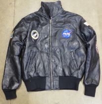 A NASA leather jacket with sewn space patches, size large, purchased at Kennedy Space Centre