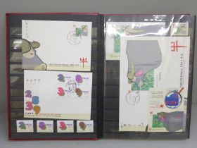 Stamps; a stockbook of Macau stamps, mini sheets and first day covers from 1996 and 1997