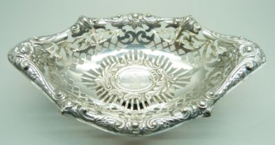 A boat shaped embossed and pierced silver pedestal dish, crested, London 1898, 86g, 16.5cm