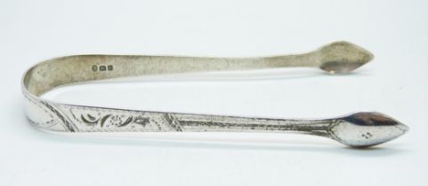 A pair of George III brite cut silver sugar bows, London 1800