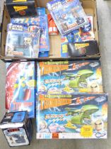 A mixed lot of toys, Thunderbirds ceramic money banks, Thunderbirds International Rescue games, Star