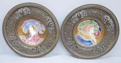 A pair of Limoges plates mounted in pierced cast metal circular frames, 25cm diameter, both plates
