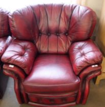 An oxblood red leather armchair