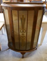 A mahogany bow front display cabinet