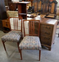 A pair of Gordon Russell mahogany dining chairs, an occasional table, a white painted chest of