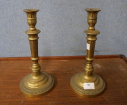 A pair of brass candlesticks