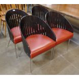 A set of four Phillipe Starck style bent plywood, chrome and red vinyl chairs