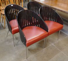 A set of four Phillipe Starck style bent plywood, chrome and red vinyl chairs